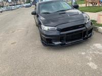 Mitsubishi Lancer X  Передний Бампер Varis версия 3 (Абс пластик)